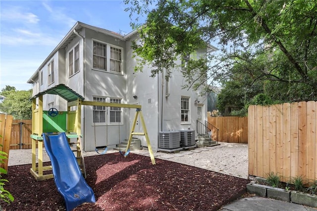 view of play area with a patio area and central AC unit