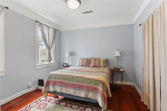 bedroom featuring dark hardwood / wood-style floors