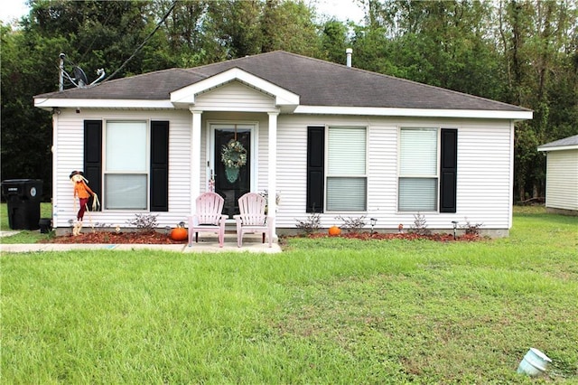 rear view of house with a lawn