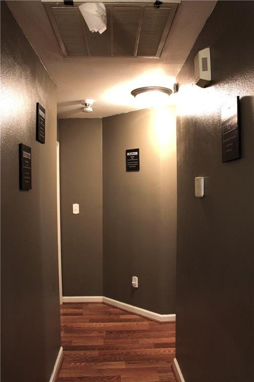 hallway featuring dark hardwood / wood-style floors