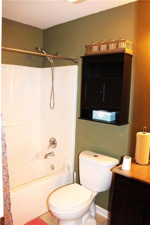 full bathroom featuring toilet, vanity, tile patterned floors, and shower / bathing tub combination