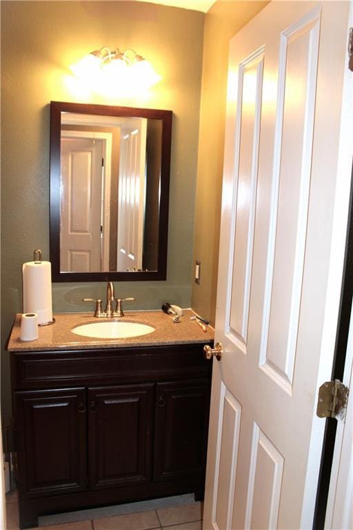 bathroom featuring tile patterned flooring and vanity