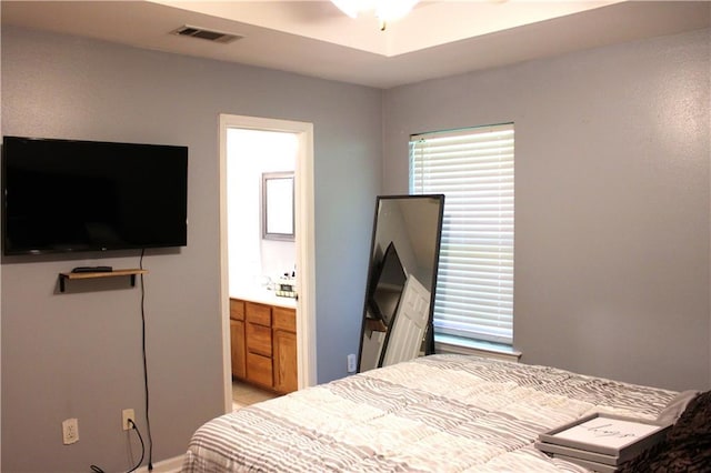 bedroom featuring ensuite bath