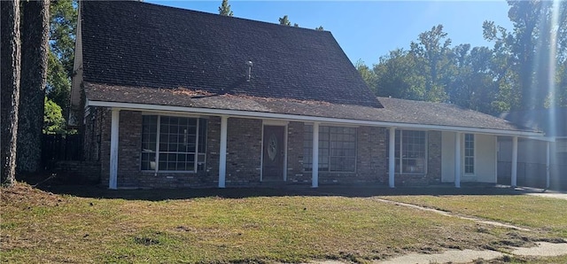 back of house with a yard