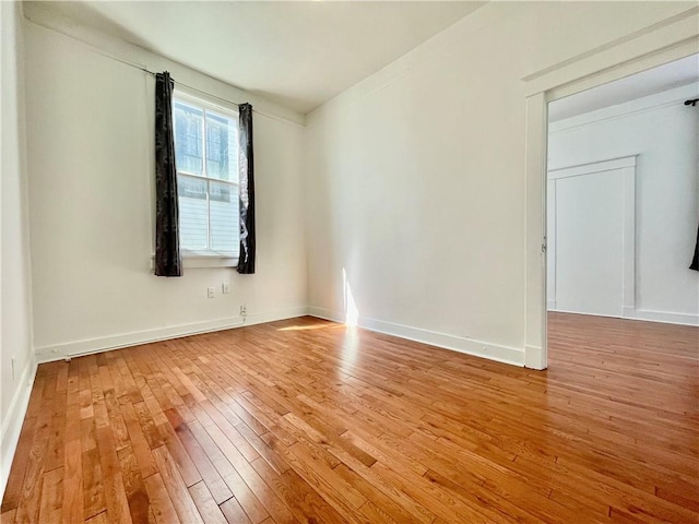 empty room with light wood-type flooring