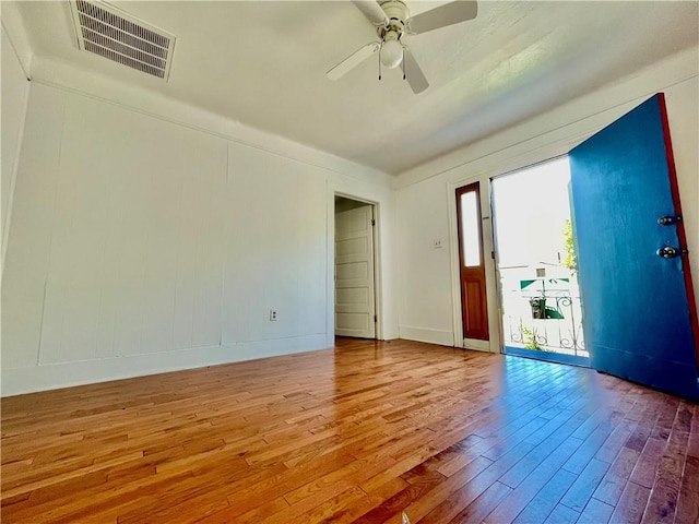 empty room featuring light hardwood / wood-style flooring and ceiling fan