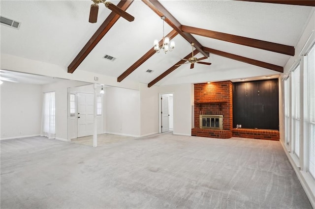 unfurnished living room featuring carpet flooring, vaulted ceiling with beams, ceiling fan with notable chandelier, and a brick fireplace