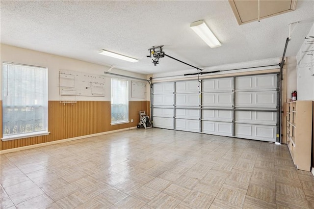 garage featuring wooden walls