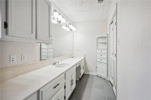 bathroom featuring vanity and a textured ceiling