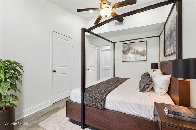 unfurnished room featuring light hardwood / wood-style flooring and ceiling fan