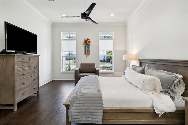 bedroom featuring crown molding, dark hardwood / wood-style floors, and ceiling fan