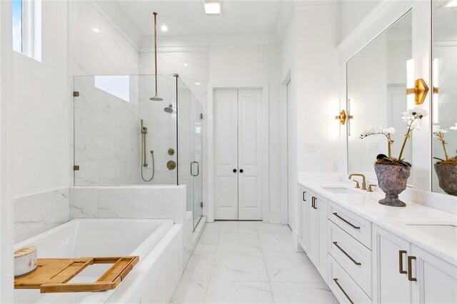 bathroom with vanity, ornamental molding, and independent shower and bath