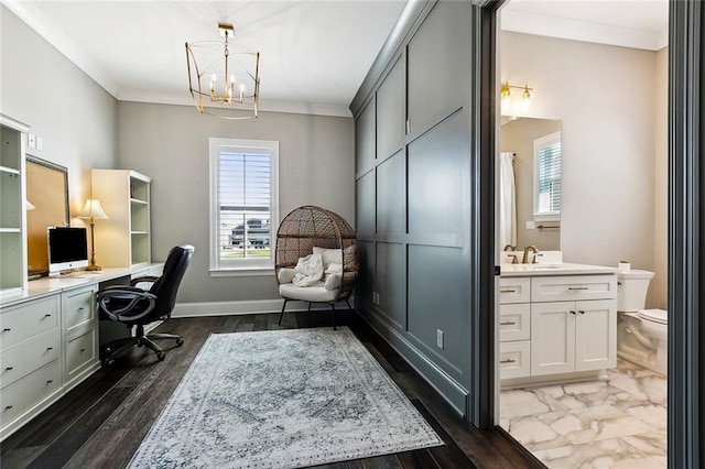 office space featuring crown molding, dark hardwood / wood-style floors, sink, and a notable chandelier