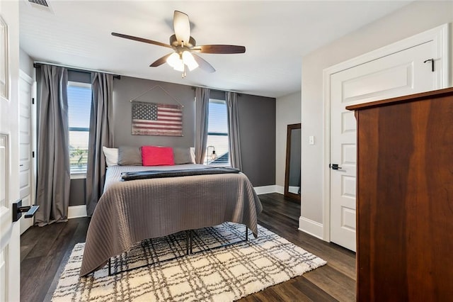 bedroom featuring dark wood-type flooring and ceiling fan