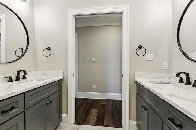 bathroom with hardwood / wood-style flooring and vanity