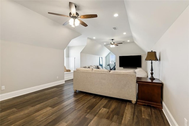 living room featuring dark hardwood / wood-style flooring, lofted ceiling, and ceiling fan