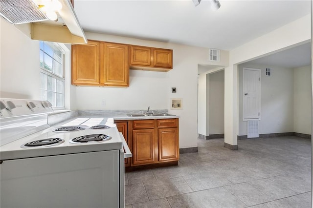 kitchen with sink, white range with electric stovetop, range hood, and light tile patterned floors