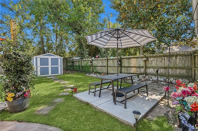 exterior space with a storage shed, a patio area, and a lawn