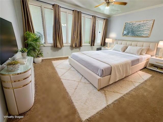 bedroom featuring a ceiling fan, baseboards, ornamental molding, and carpet flooring