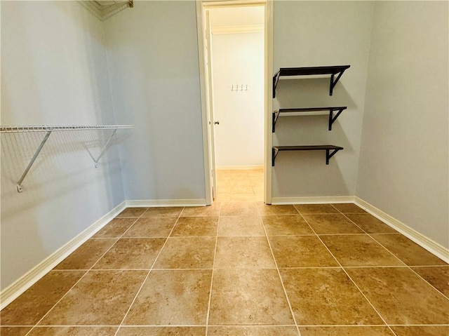 spacious closet featuring tile patterned floors