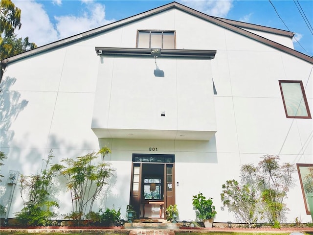 exterior space featuring stucco siding