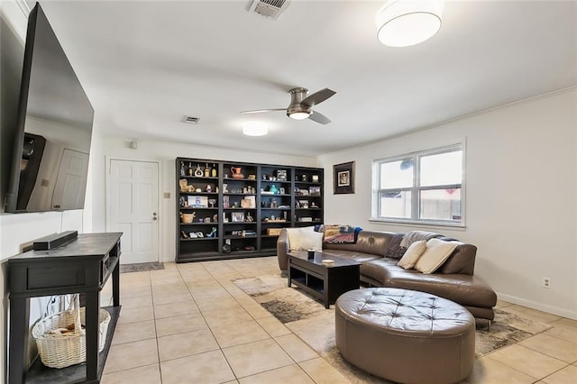 living room with ceiling fan and light tile patterned floors