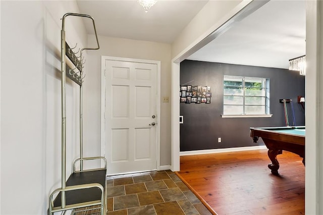 mudroom with dark wood-type flooring and billiards