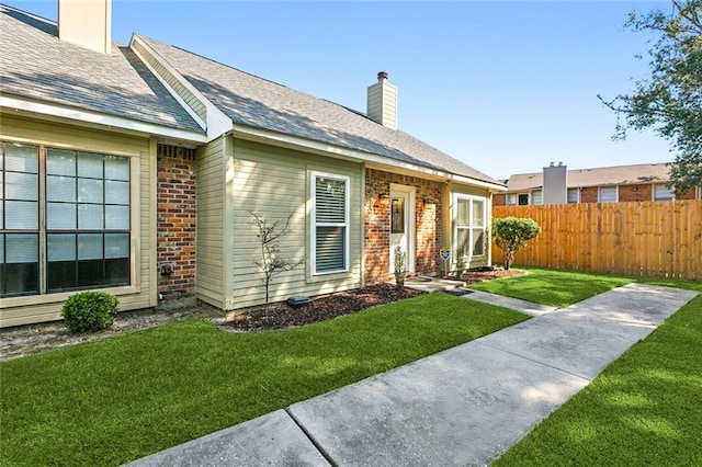 exterior space featuring a lawn