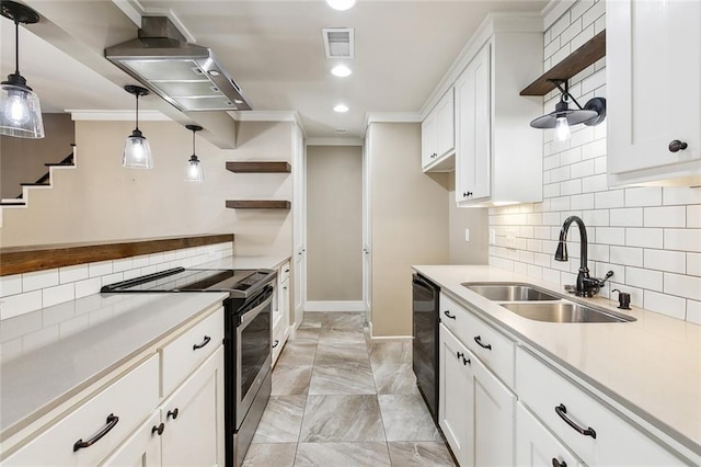 kitchen with white cabinets, sink, decorative light fixtures, and electric stove