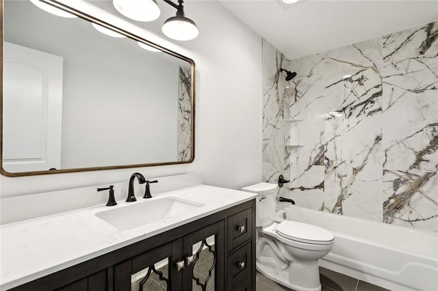 full bathroom featuring tile patterned floors, vanity, toilet, and tiled shower / bath