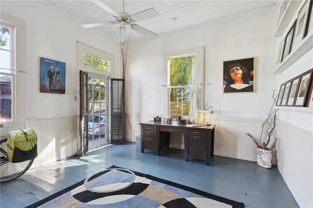 office space with dark wood-type flooring, a healthy amount of sunlight, and ceiling fan