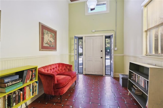 entrance foyer featuring a towering ceiling