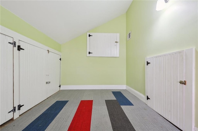 interior space featuring lofted ceiling