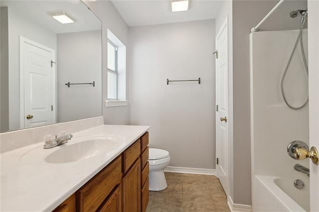 full bathroom featuring tile patterned flooring, vanity, toilet, and shower / washtub combination