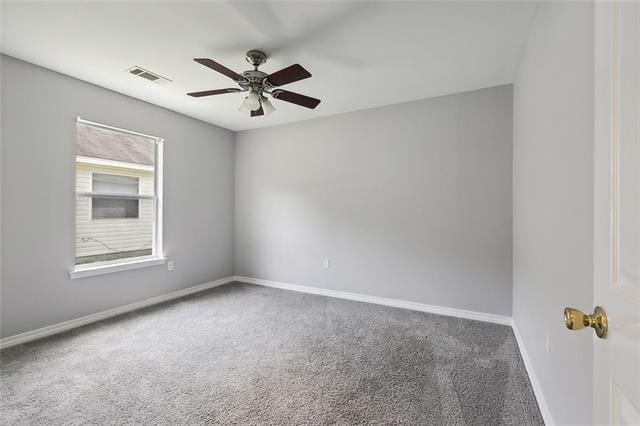 carpeted empty room with ceiling fan