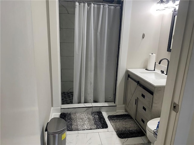 bathroom with walk in shower, vanity, and toilet