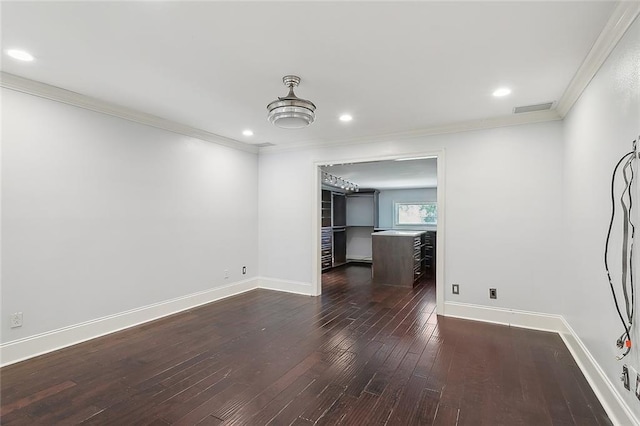 unfurnished living room featuring ornamental molding and dark hardwood / wood-style floors