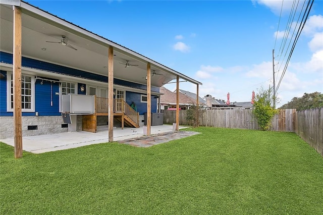 view of yard with a patio and ceiling fan