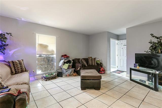 living room with light tile patterned floors