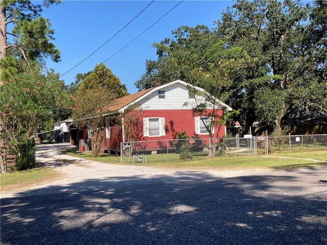 view of property exterior with a yard