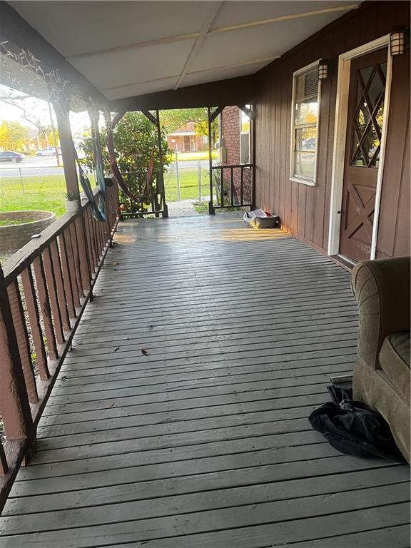 wooden terrace featuring a porch