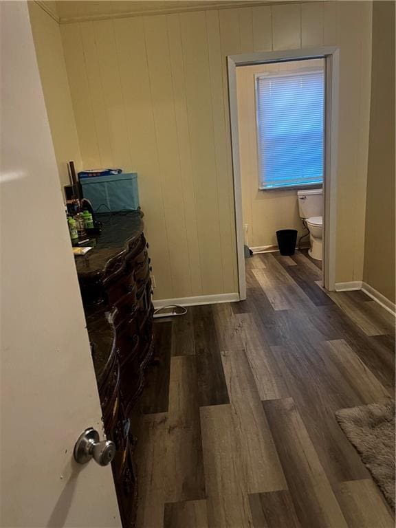 bedroom featuring dark hardwood / wood-style flooring