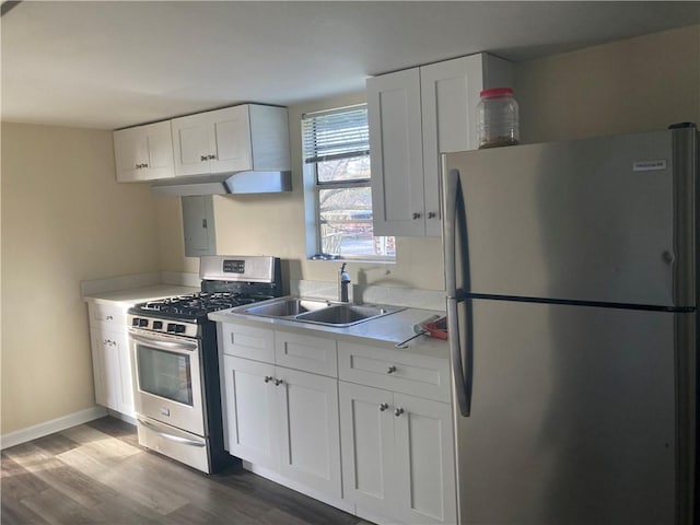 kitchen featuring sink, dark wood-type flooring, white cabinets, and appliances with stainless steel finishes