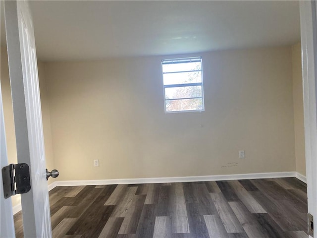 unfurnished room featuring dark hardwood / wood-style floors