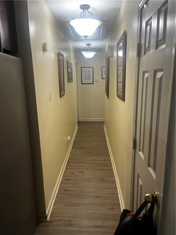 hallway featuring dark hardwood / wood-style floors