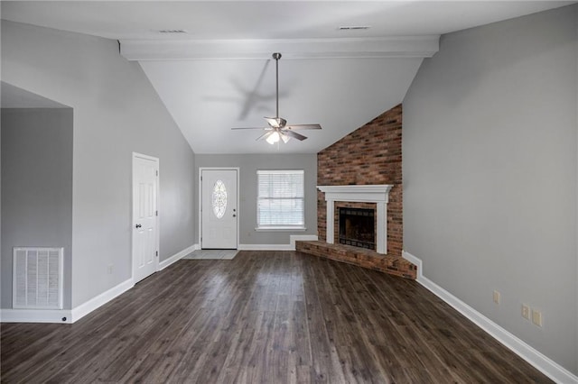 unfurnished living room featuring lofted ceiling with beams, a fireplace, dark wood-type flooring, and ceiling fan