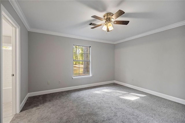 carpeted empty room featuring ceiling fan and ornamental molding