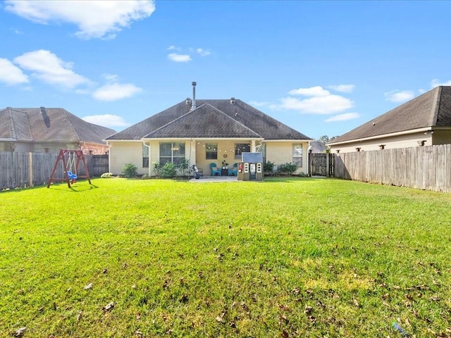 back of property featuring a patio and a lawn