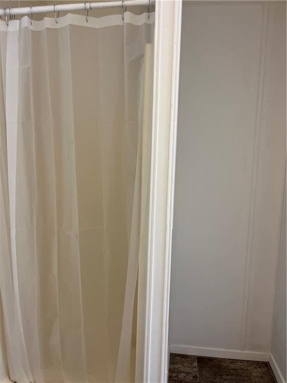 bathroom featuring curtained shower