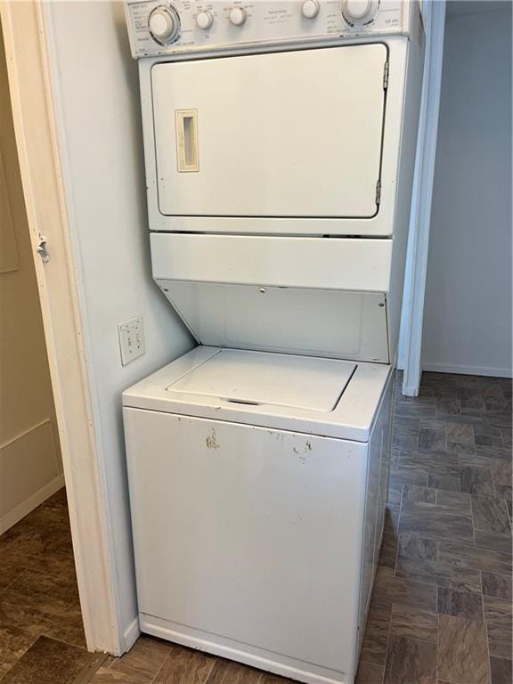 laundry area with stacked washer / dryer